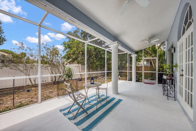 sunroom / solarium featuring ceiling fan and vaulted ceiling