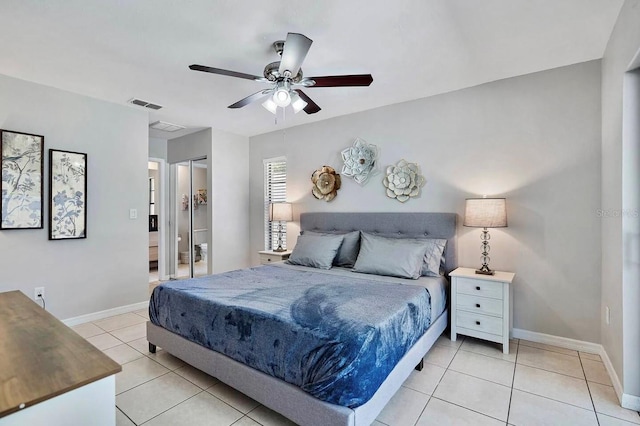 tiled bedroom with ceiling fan