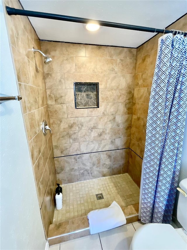 bathroom with toilet and walk in shower