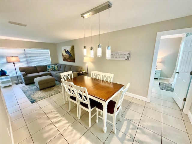 dining space with light tile patterned floors