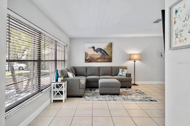 living room with light tile patterned flooring