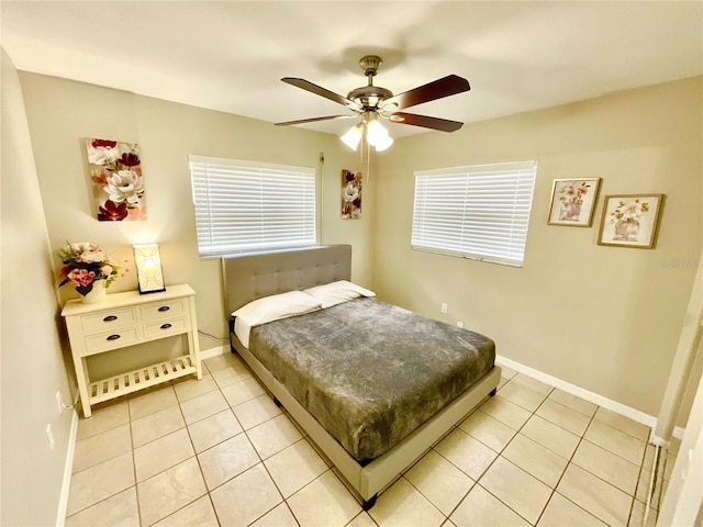 tiled bedroom with ceiling fan