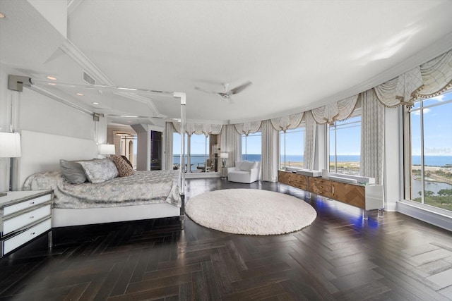 bedroom with ceiling fan, a water view, parquet floors, and ornamental molding