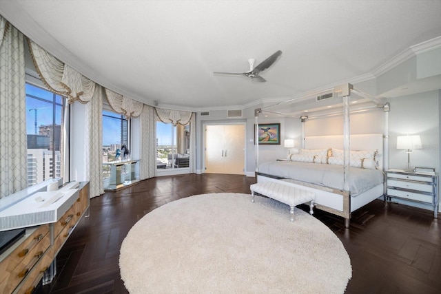 bedroom featuring ceiling fan, dark parquet flooring, and crown molding