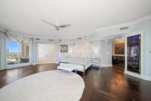 bedroom featuring dark parquet floors, ceiling fan, and ornamental molding