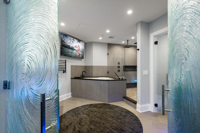 bathroom featuring tile patterned flooring and shower with separate bathtub