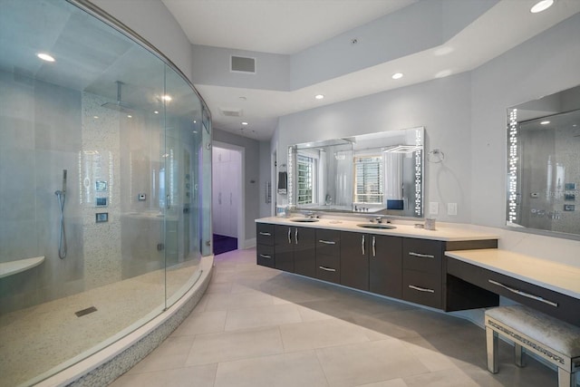 bathroom with vanity, tile patterned floors, and walk in shower