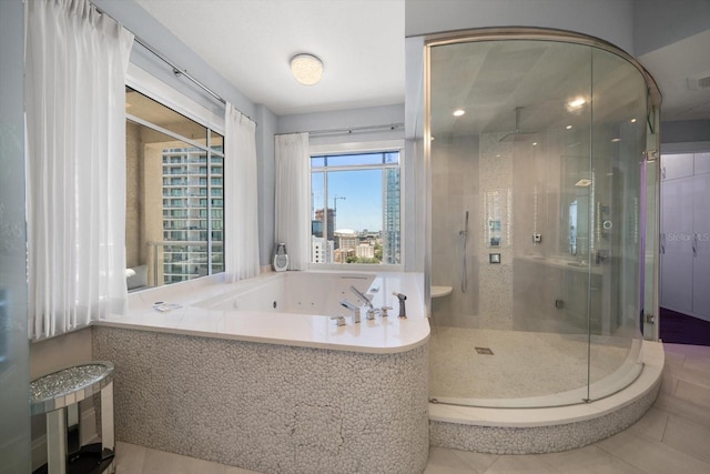 bathroom featuring separate shower and tub and tile patterned flooring