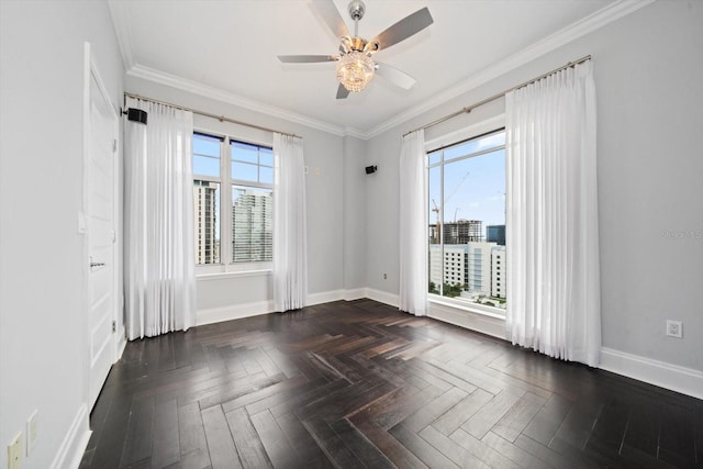 unfurnished room featuring dark parquet floors, ceiling fan, and ornamental molding