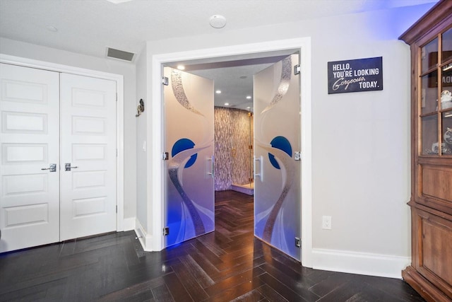 interior space featuring dark parquet flooring