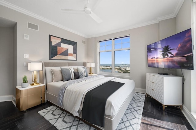 bedroom featuring ceiling fan, ornamental molding, and dark wood-type flooring