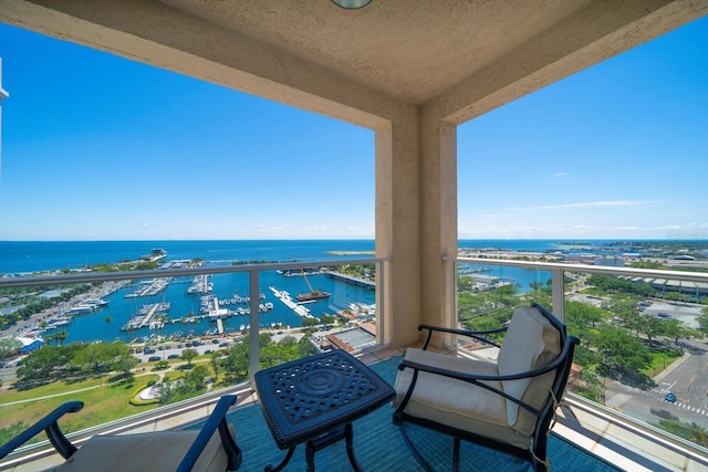 balcony featuring a water view