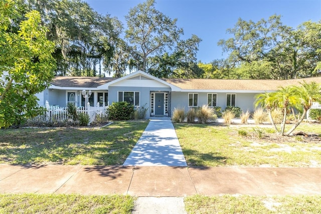 ranch-style house with a front lawn