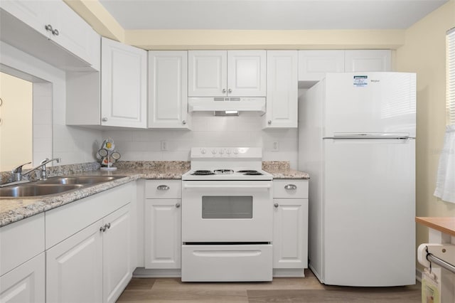 kitchen with sink, white cabinetry, hardwood / wood-style flooring, and white appliances