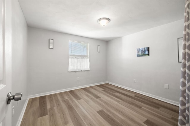 empty room featuring hardwood / wood-style floors