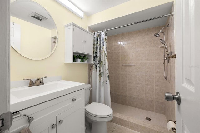 bathroom with a shower with curtain, tile flooring, vanity, and toilet