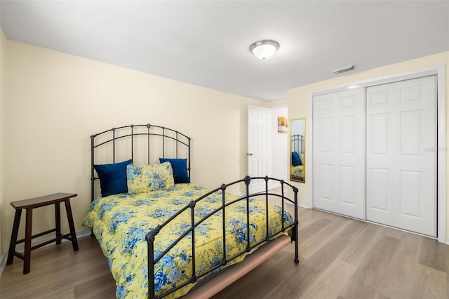 bedroom featuring a closet and hardwood / wood-style flooring