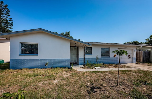 single story home featuring a garage