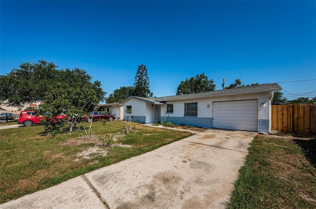 single story home with a garage and a front yard