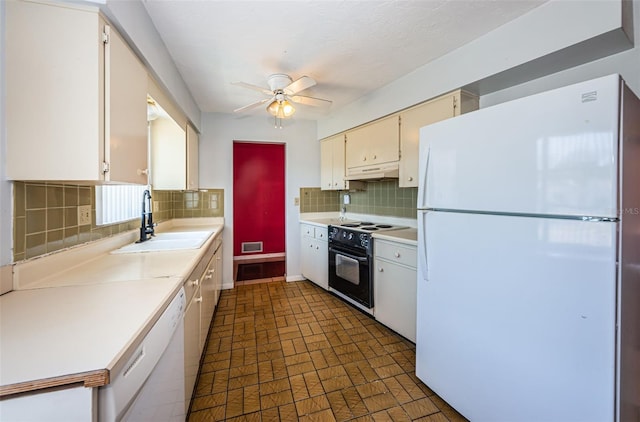 kitchen with cream cabinets, ceiling fan, tasteful backsplash, sink, and white appliances