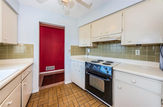 kitchen featuring ceiling fan, white range with electric cooktop, tasteful backsplash, and light tile floors