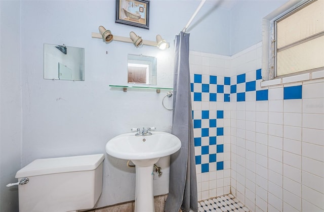 bathroom with walk in shower and toilet