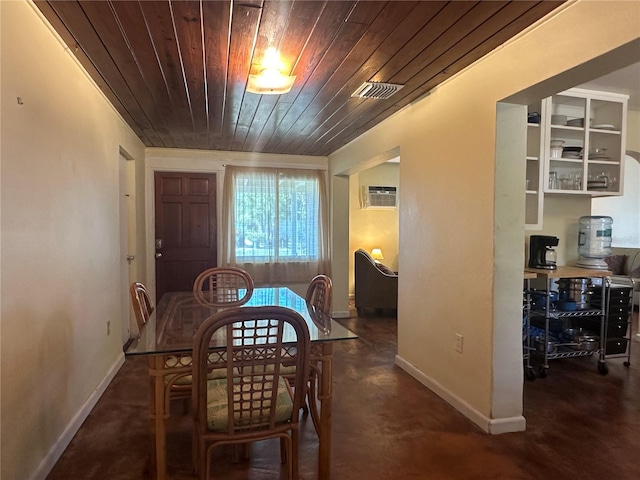 dining space featuring a wall mounted air conditioner and wood ceiling