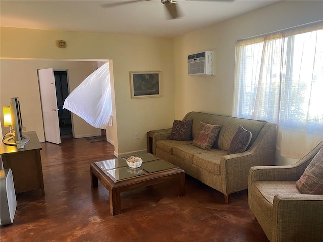 living room with ceiling fan and an AC wall unit