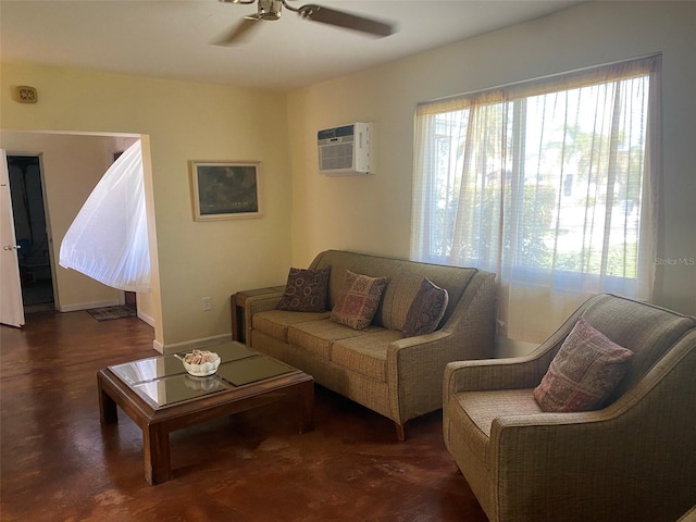 living room with a wall unit AC and ceiling fan