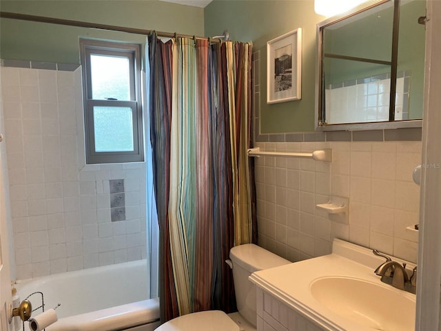 full bathroom featuring vanity, toilet, shower / bathtub combination with curtain, and tile walls