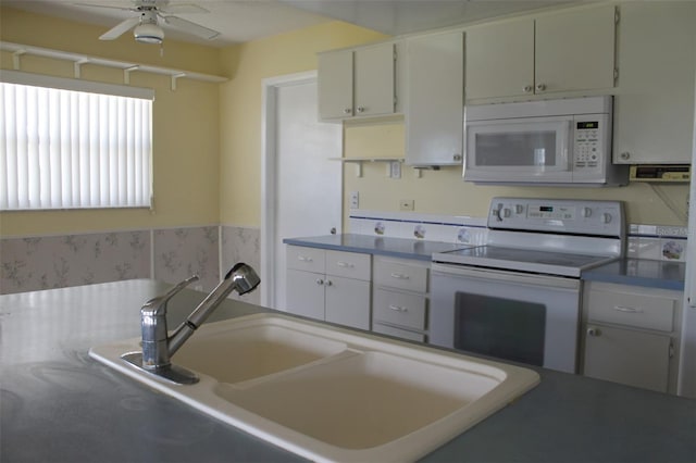 kitchen with ceiling fan, sink, and white appliances