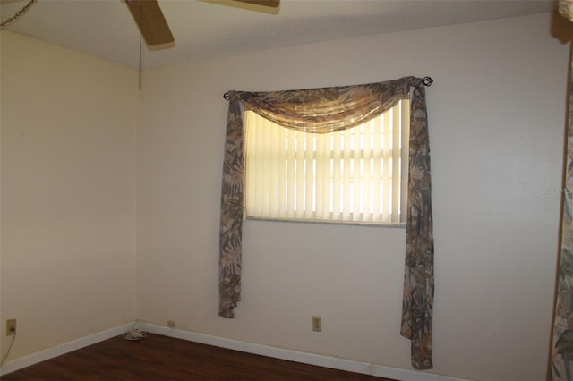 unfurnished room featuring ceiling fan and dark hardwood / wood-style floors