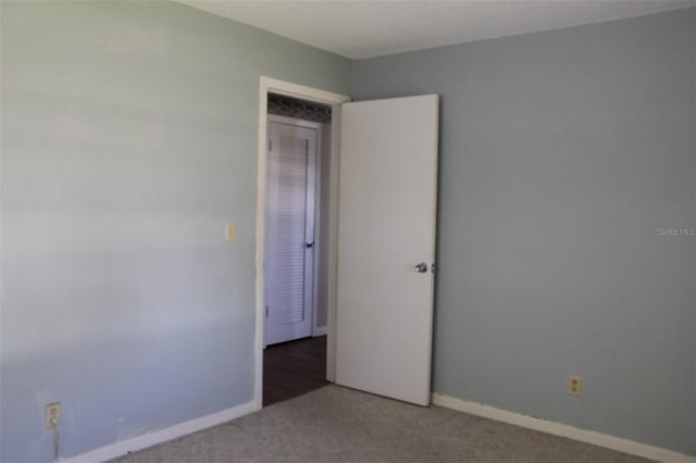 unfurnished room featuring carpet floors