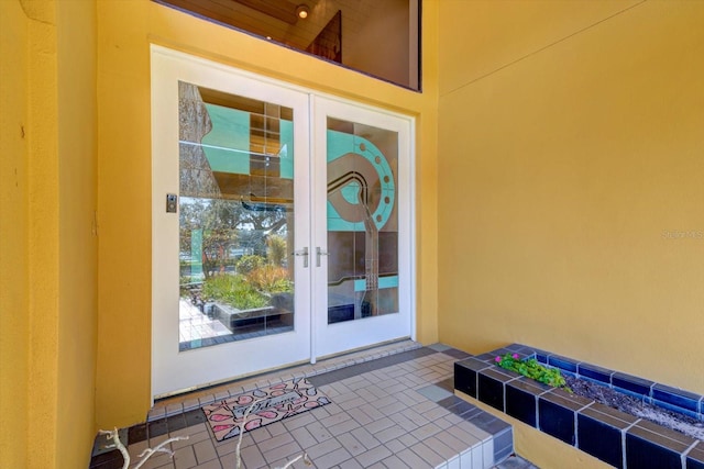 doorway to property featuring french doors