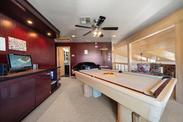 recreation room with ceiling fan, light colored carpet, a textured ceiling, and billiards