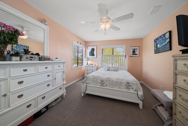 bedroom featuring dark colored carpet and ceiling fan