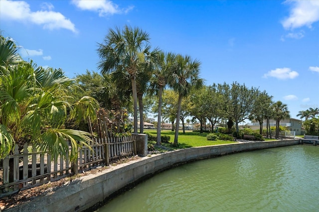 surrounding community featuring a water view