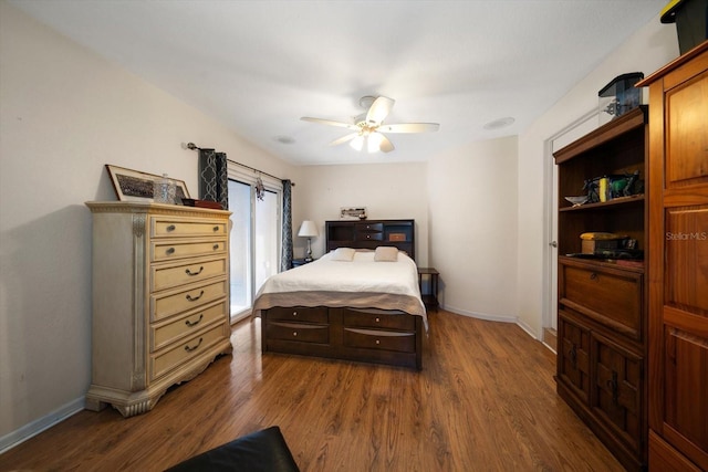 bedroom featuring ceiling fan and dark hardwood / wood-style flooring