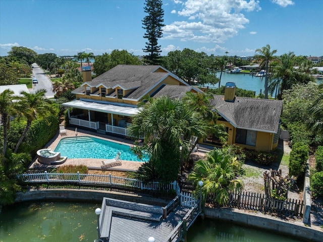 exterior space with a patio area and a water view