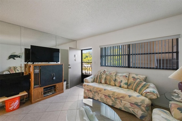 living room featuring light tile patterned floors and a textured ceiling