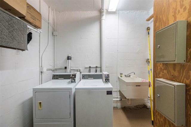 washroom featuring washer and clothes dryer and sink