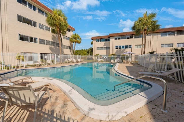 view of swimming pool with a patio area