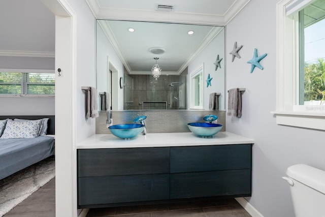 full bath featuring visible vents, decorative backsplash, tiled shower, ornamental molding, and vanity