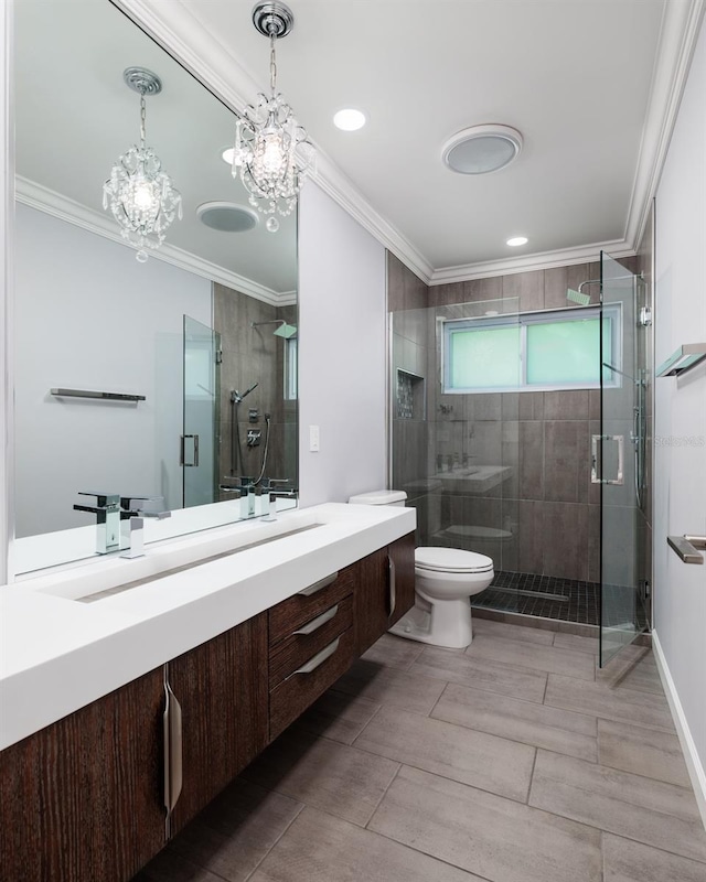 full bath with ornamental molding, a stall shower, vanity, and toilet