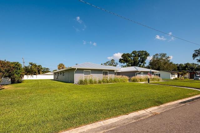 view of front of home with a front lawn