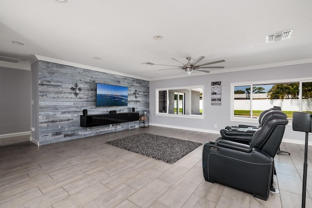 living room featuring an accent wall, visible vents, crown molding, and baseboards