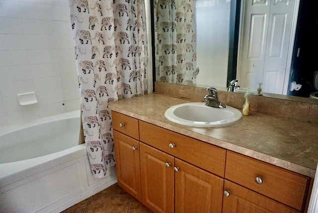 bathroom with tile patterned floors, vanity, and shower / tub combo with curtain