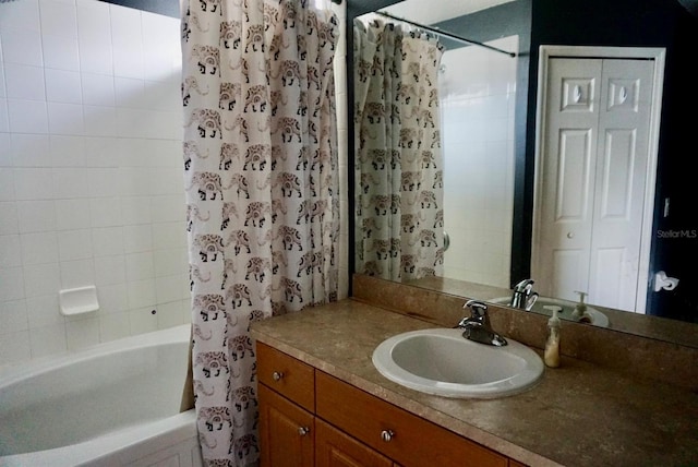 bathroom featuring vanity and shower / bath combo with shower curtain