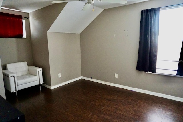 bonus room featuring lofted ceiling, ceiling fan, and dark hardwood / wood-style floors