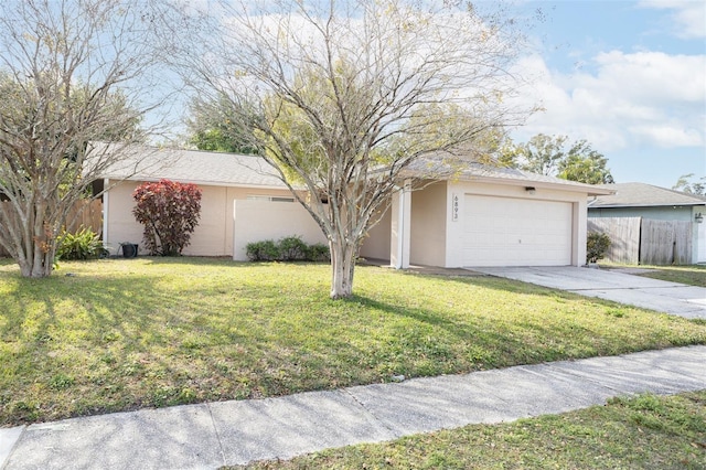 single story home with a front lawn and a garage